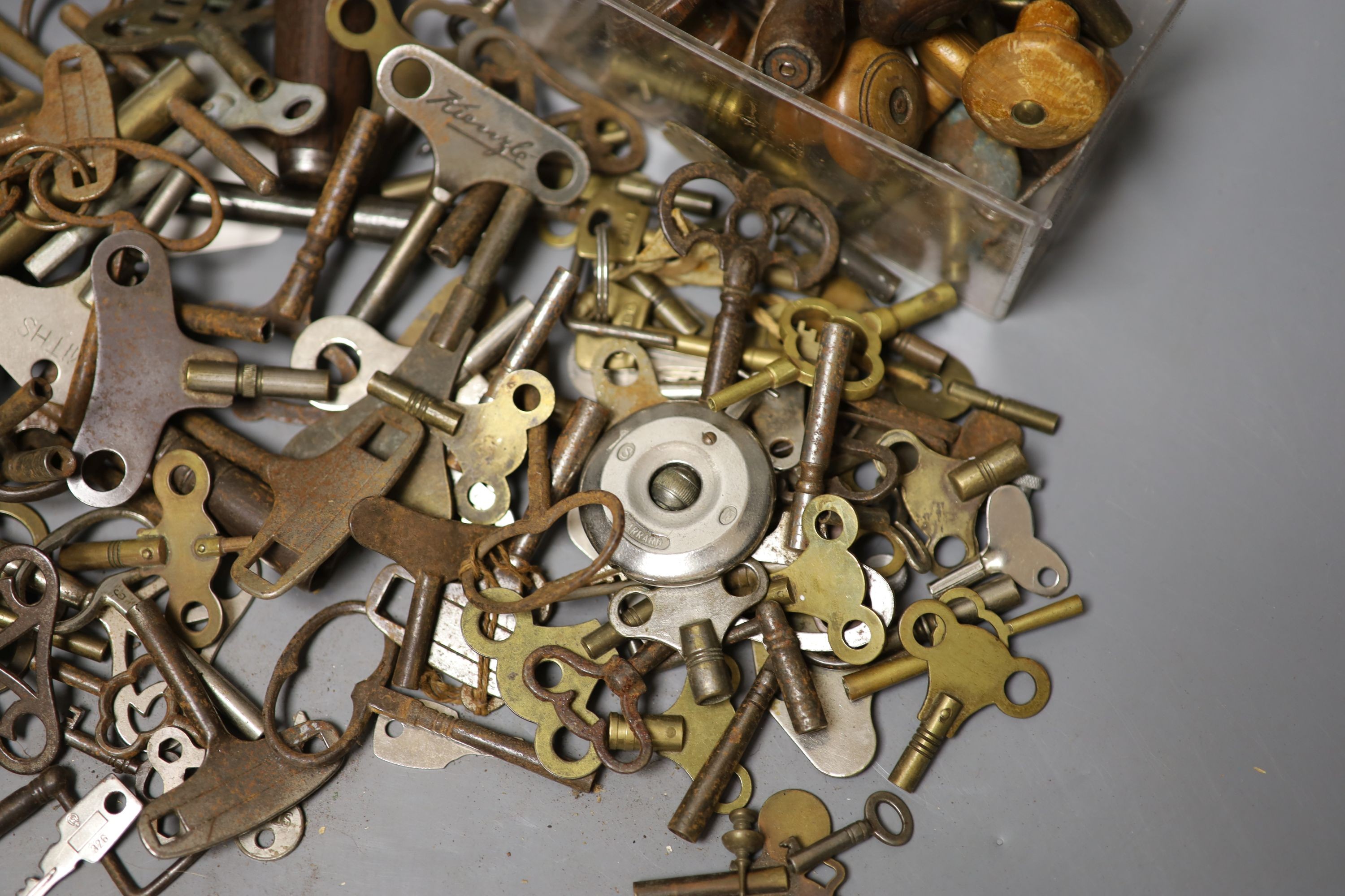 Assorted watch keys and winders and a corkscrew